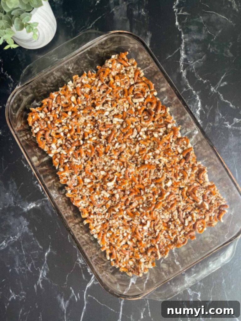 Pretzel crust pressed into a glass 9x13 baking dish.