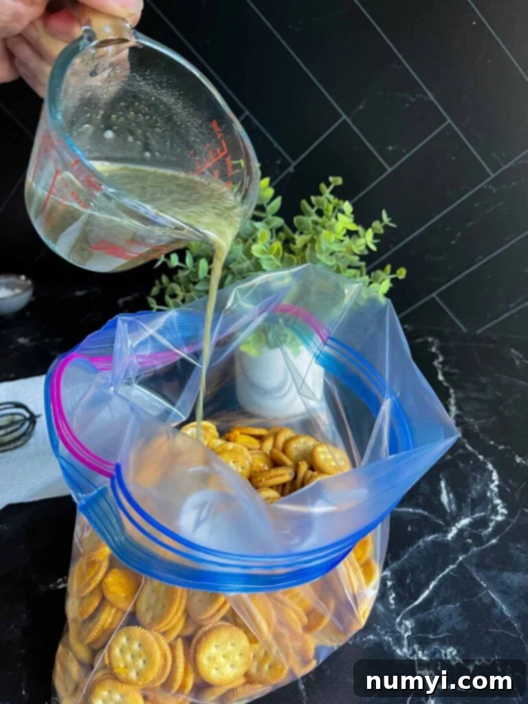 Zesty Ranch Cheese Poppers 4 Adding the mixture to the bag of crackers.
