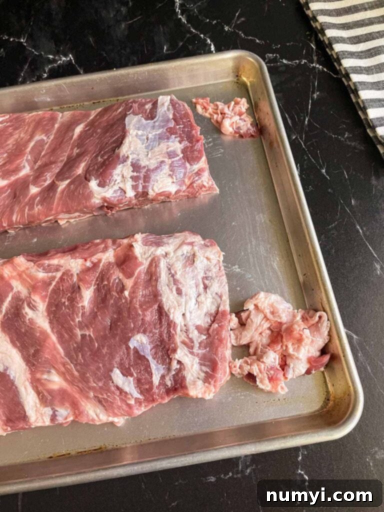 Two slabs of St. Louis style ribs after excess fat has been meticulously trimmed.