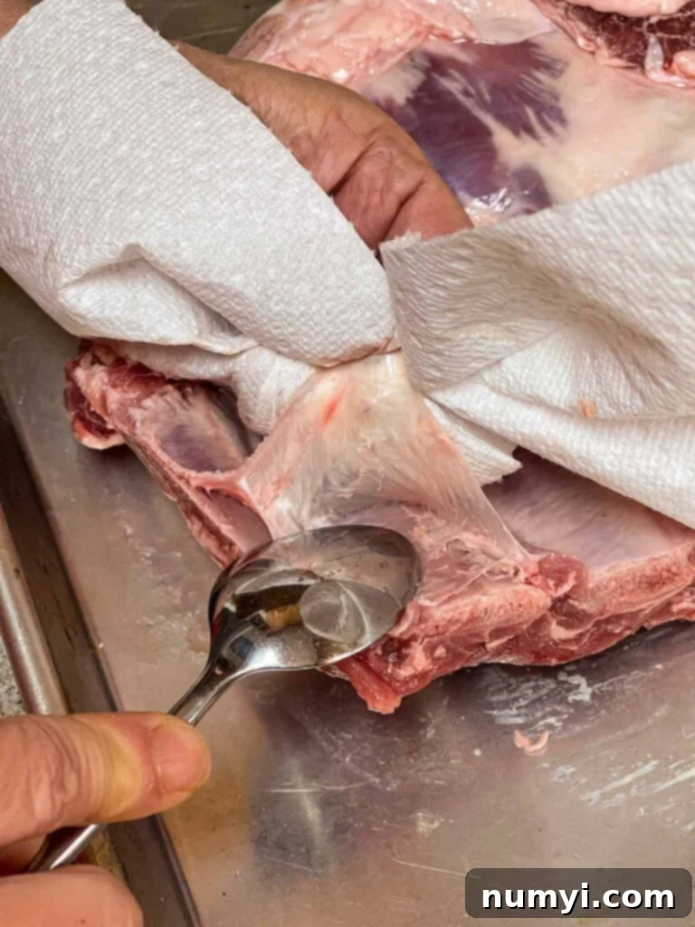Demonstration of removing the silver skin membrane from a rack of ribs.