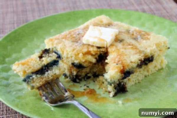 Delicious Blueberry Oven Pancake cut into squares, fresh from the sheet pan, ready to be served.