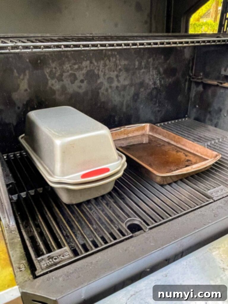 Sourdough bread baking inside the smoker with a water pan.