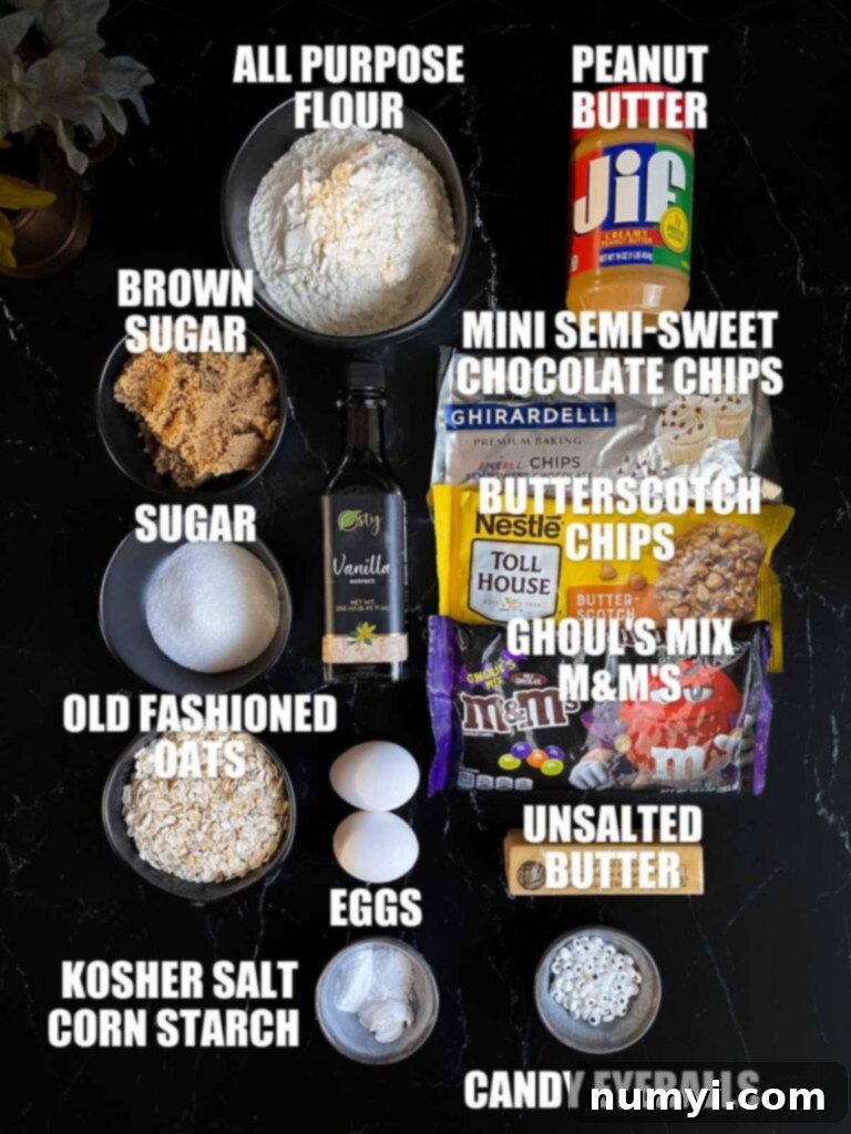 All the necessary ingredients for making Halloween Monster Eye Cookies, neatly laid out on a dark kitchen counter.