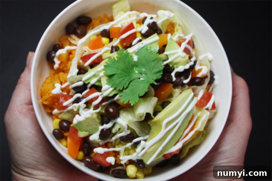 Chicken burrito bowl in a white bowl.