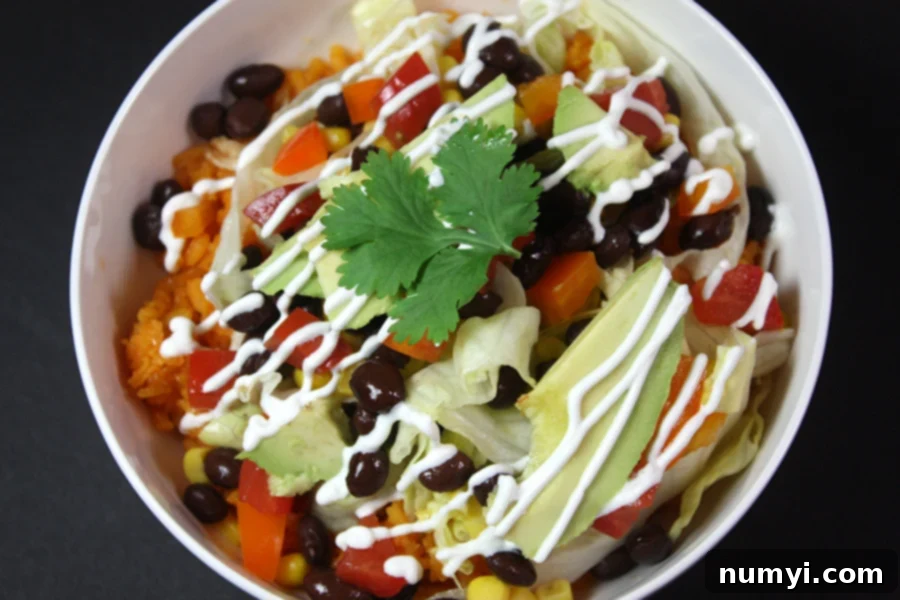Chicken burrito bowl in a white bowl.