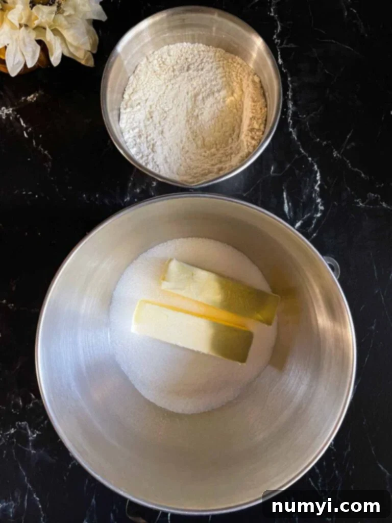 Ingredients for old fashioned sour cream pound cake in mixing bowls.
