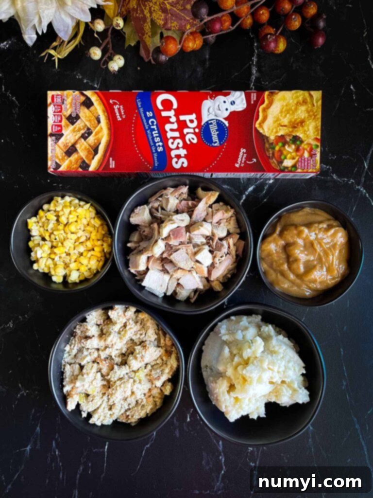 Thanksgiving Encore Pie 5 Various containers of Thanksgiving leftovers, including turkey, mashed potatoes, and dressing, laid out as ingredients for a pie.