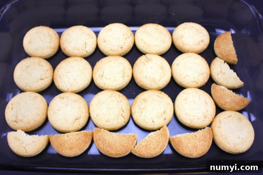 Shortbread cookies in the bottom of a glass baking dish.