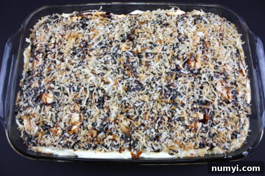 Samoa Cake in a glass baking dish.