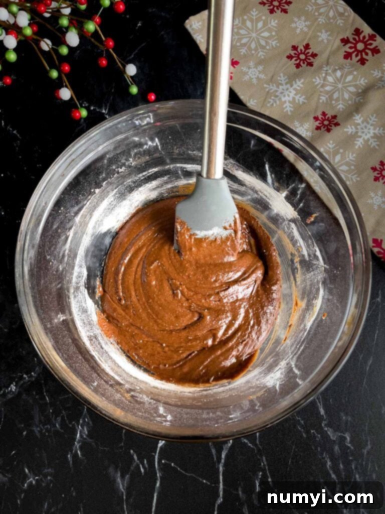 Chocolate crinkle cookies batter in a glass bowl,