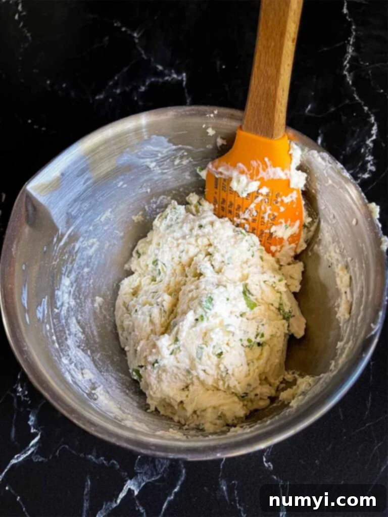 Dumpling dough in a stainless steel bowl.