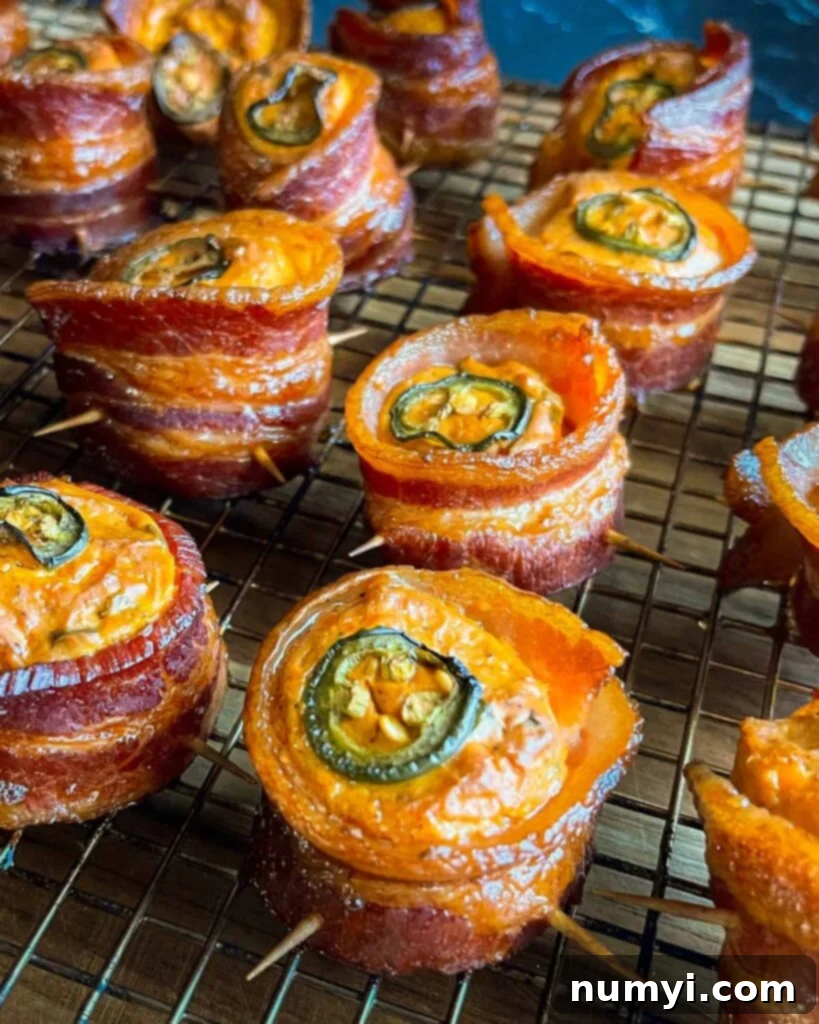 Smoked Bacon Sausage Bites 2 Golden-brown smoked pig shots resting on a wire cooling rack, ready to be served as a delicious appetizer.
