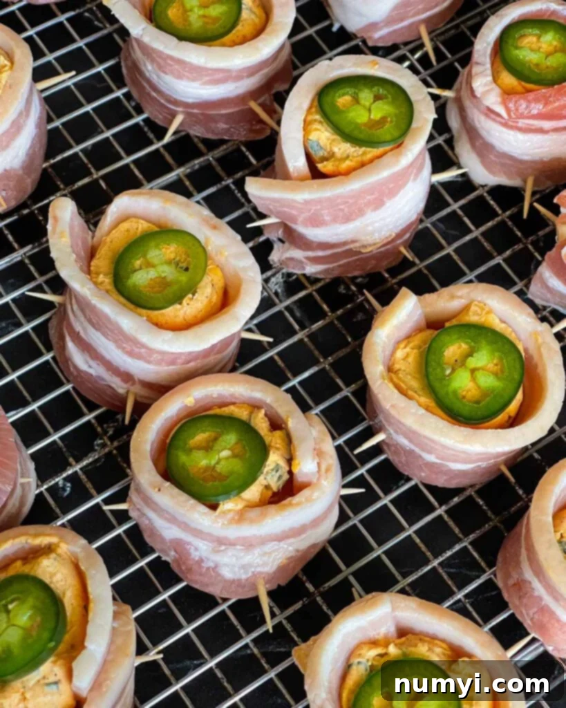 Smoked Bacon Sausage Bites 11 Smoked pig shots with an optional thin jalapeño slice on top of the cheese filling.