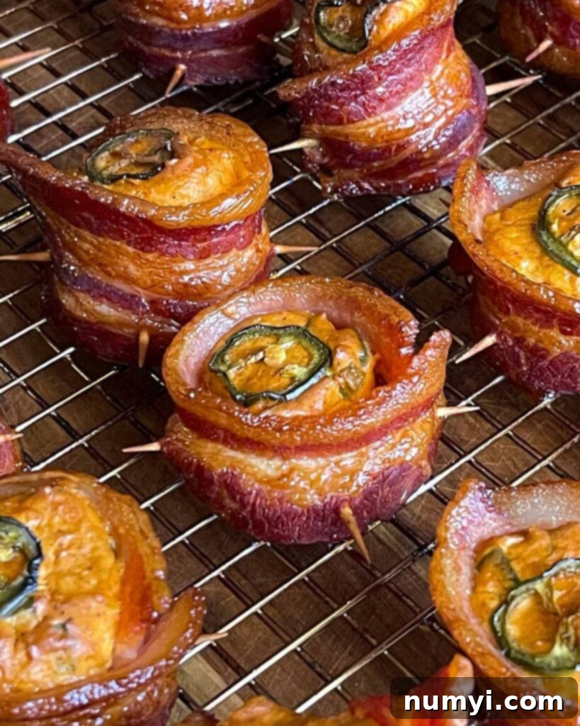 Smoked Bacon Sausage Bites 15 A large batch of smoked pig shots on a wire cooling rack, ready for a gathering or party.