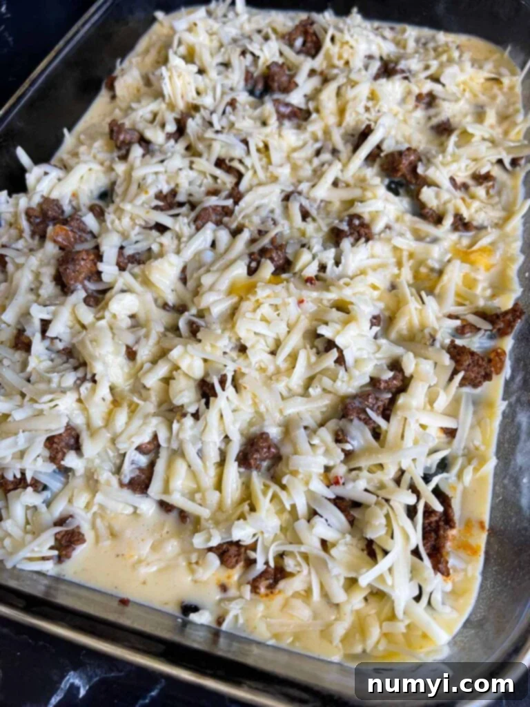 The Ultimate Chile Relleno Casserole 12 Chile relleno casserole in glass baking dish ready to be baked.