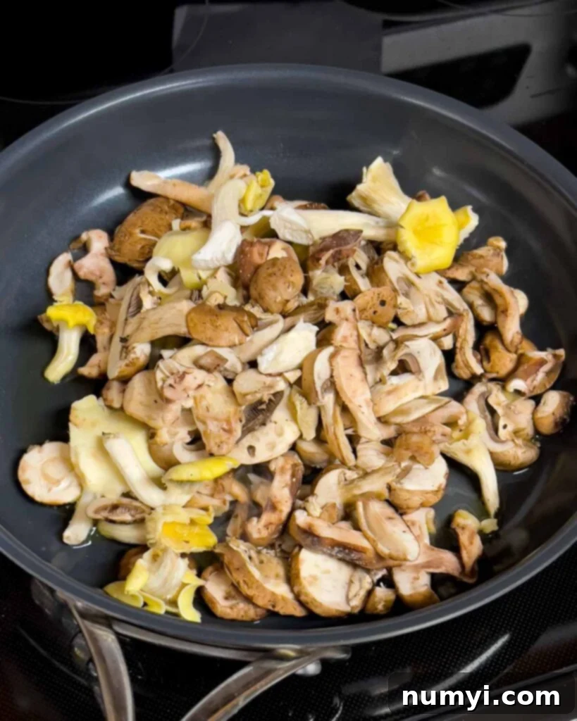 Velvety Mushroom Risotto 12 Assorted sliced mushrooms sizzling in a hot skillet with olive oil.