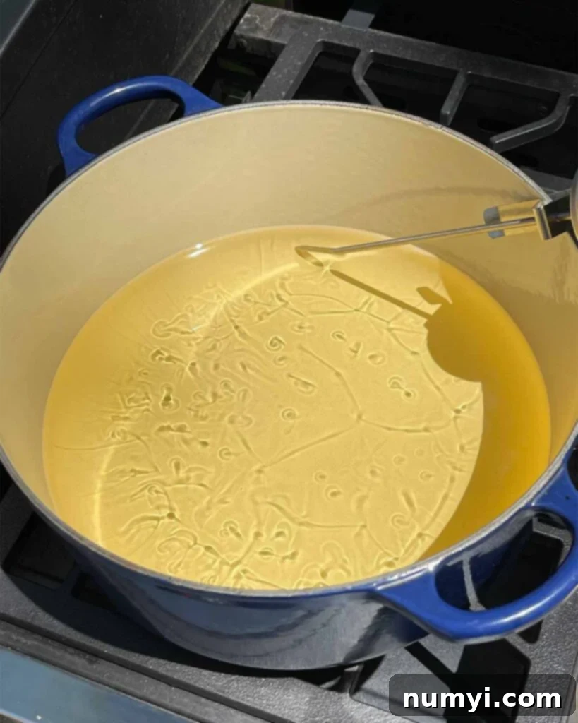 Oil heating in a large dutch oven.