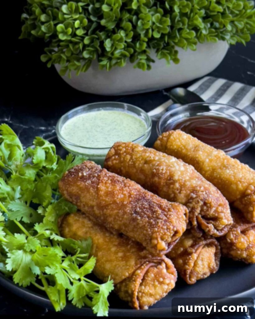 Redneck egg rolls on a dark plate.