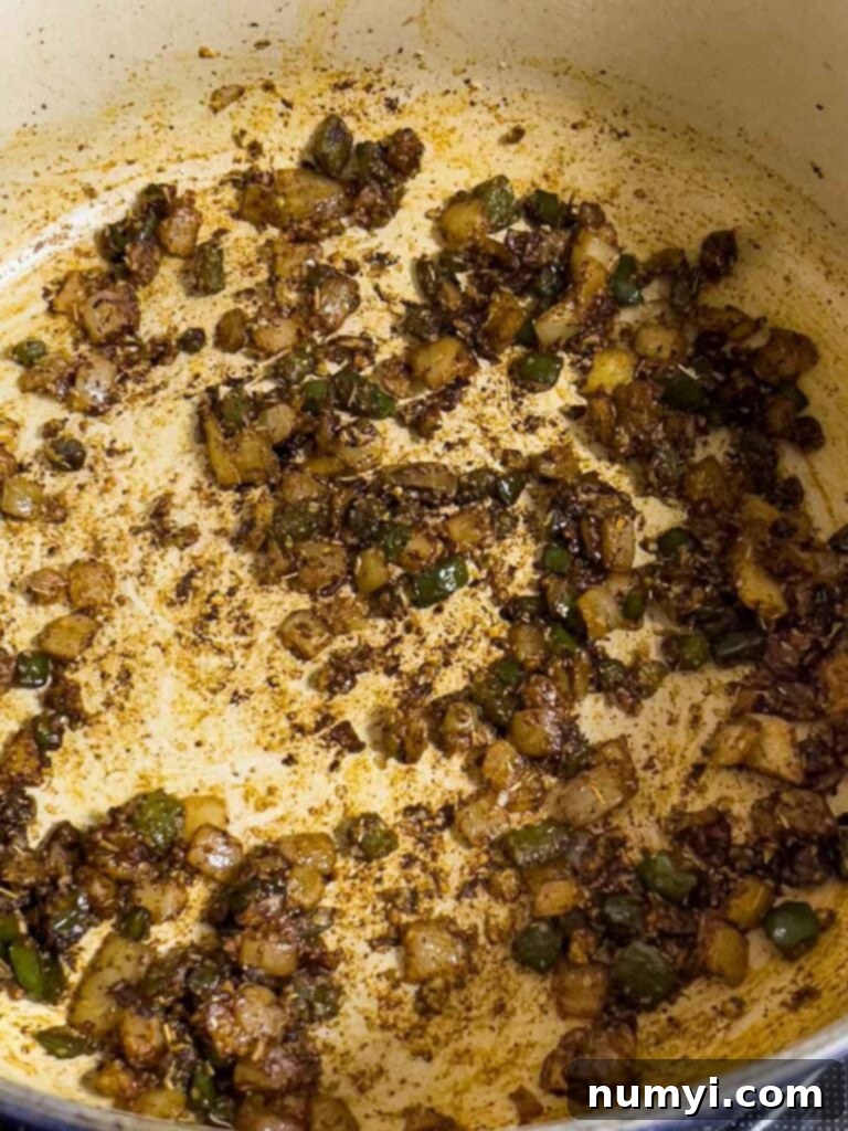Herbs and onions cooked down in a dutch oven.