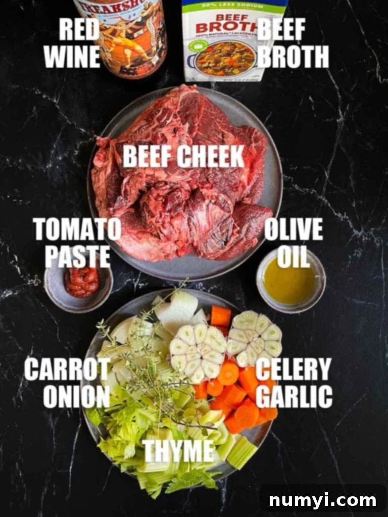 A flat lay of the ingredients for braised beef cheeks, including fresh beef cheeks, carrots, celery, onion, garlic, thyme, tomato paste, red wine, beef stock, and seasonings.