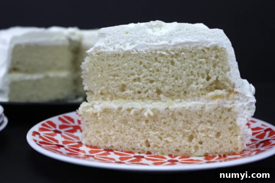 Classic White Cake 2 A beautifully decorated white cake, ready to be served, highlighting its bakery-style perfection.