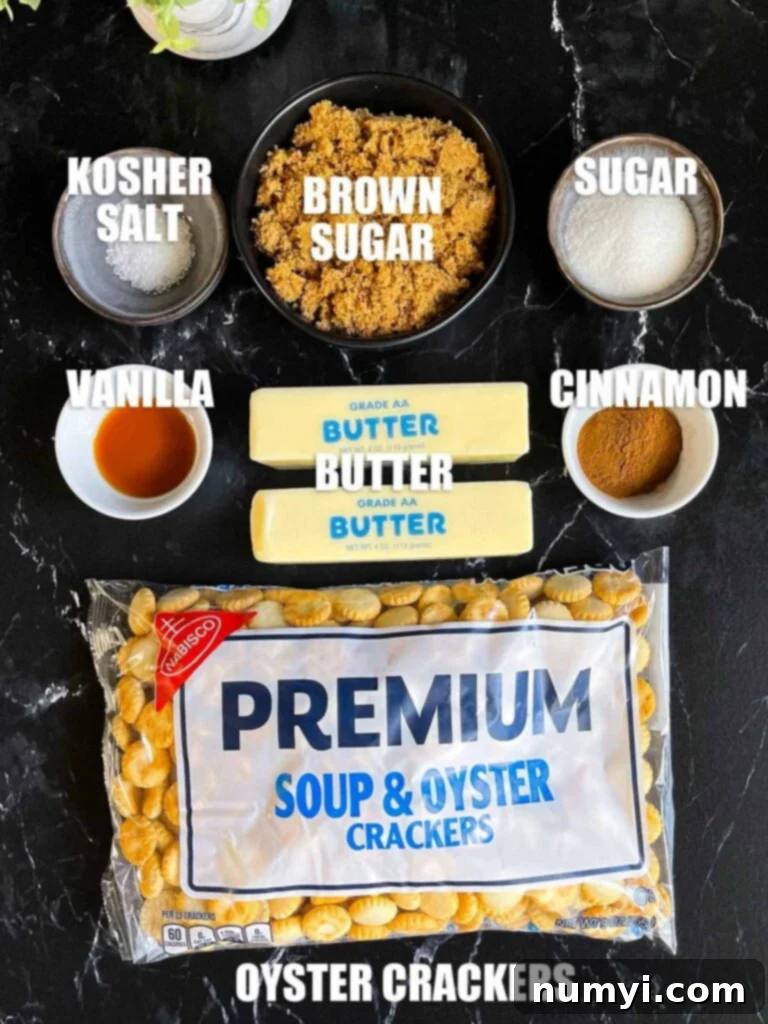 Ingredients for oyster cracker churro snack mix on a dark surface.