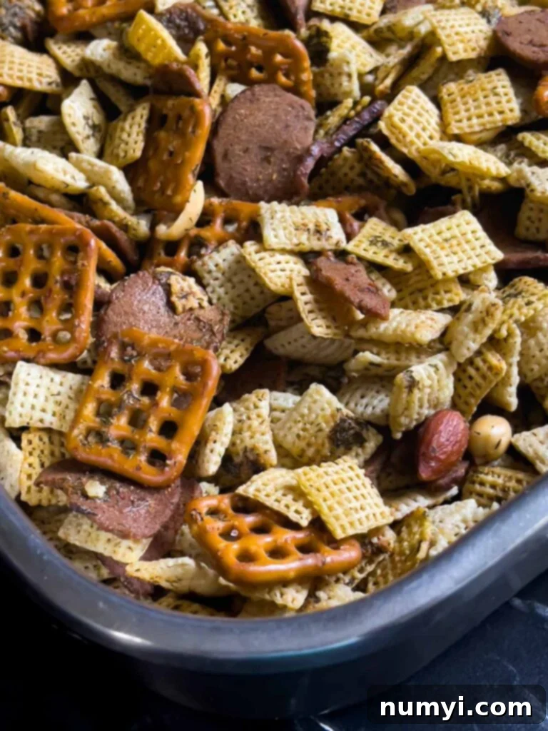 Tangy Dill Chex Crunch 7 Baked Dill Pickle Chex mix, perfectly golden and seasoned in a large baking pan, ready to cool.