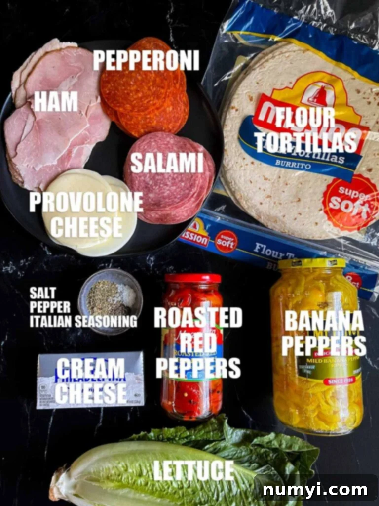 Various fresh ingredients laid out, including tortillas, deli meats, cheese, lettuce, and cream cheese spread components, all ready for making Italian pinwheels.