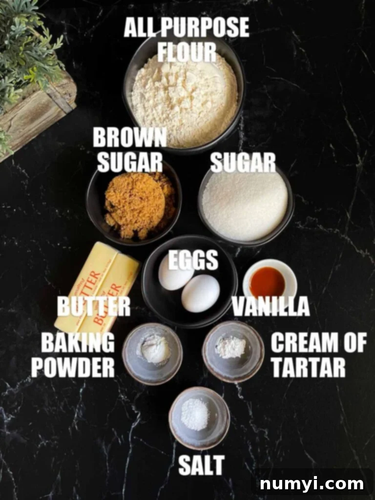Effortlessly Chewy Snickerdoodle Bars 3 Ingredients needed to make snickerdoodle bars, including flour, sugars, butter, and eggs, arranged on a dark surface.