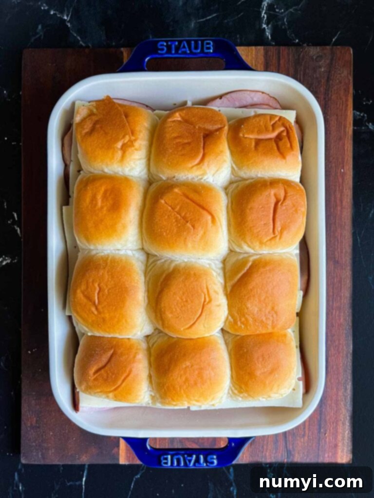 Whip Up Easy Monte Cristo Sliders for Your Next Bash 12 Monte Cristo sliders in a baking dish.