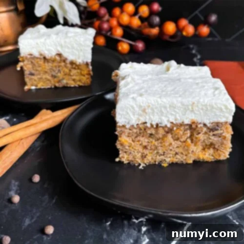 Spiced Sweet Potato Cake 14 Two slices of sweet potato cake on dark plates on a dark surface.