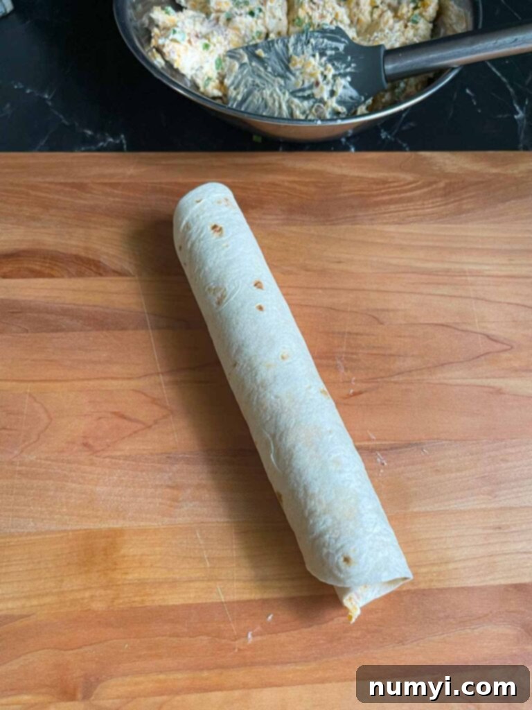 A rolled up Jalapeno Popper pinwheel, uncut.