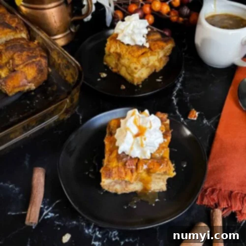 Salted Caramel Swirl Pumpkin Bread Pudding 13 A delicious slice of pumpkin bread pudding, garnished with whipped cream and a generous drizzle of salted caramel sauce, displayed on a dark surface.