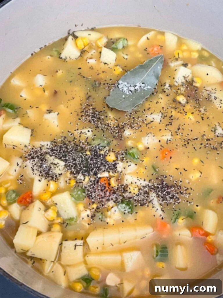 Velvety Potato Corn Chowder with Crispy Bacon 9 Ingredients for potato corn chowder in a dutch oven.
