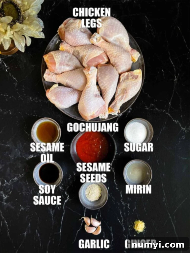 Various ingredients laid out for Gochujang chicken legs, including gochujang, soy sauce, mirin, and garlic.