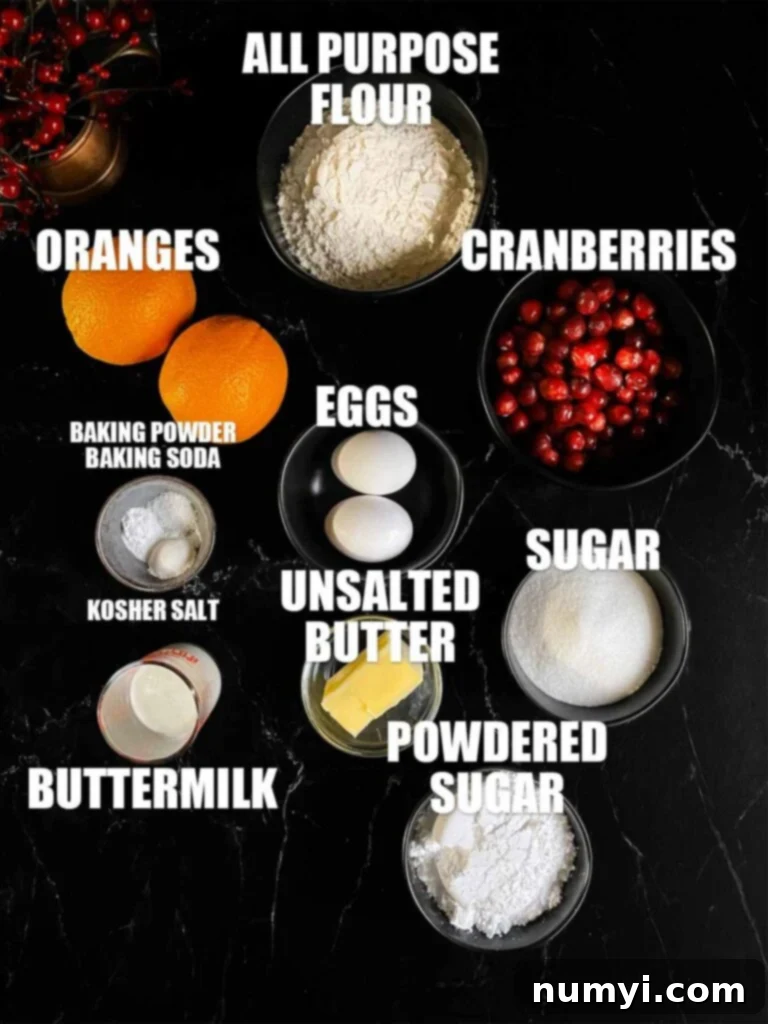 Zesty Cranberry Orange Loaf 3 Ingredients needed for Cranberry Orange bread on a dark surface.