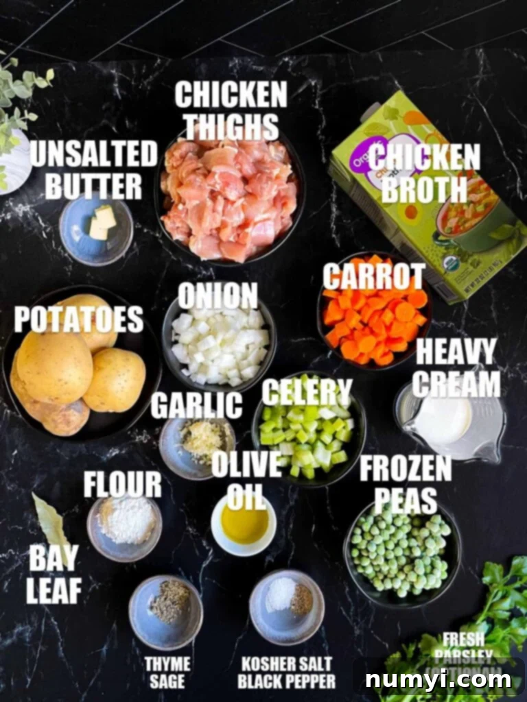 Ingredients needed to make chicken stew laid out on a table.
