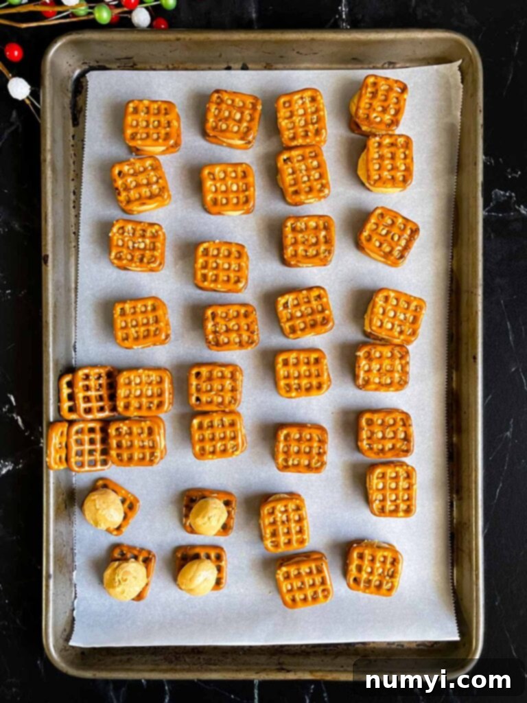 Peanut butter mixture rolled into balls and placed on the pretzels on prepared baking sheet.