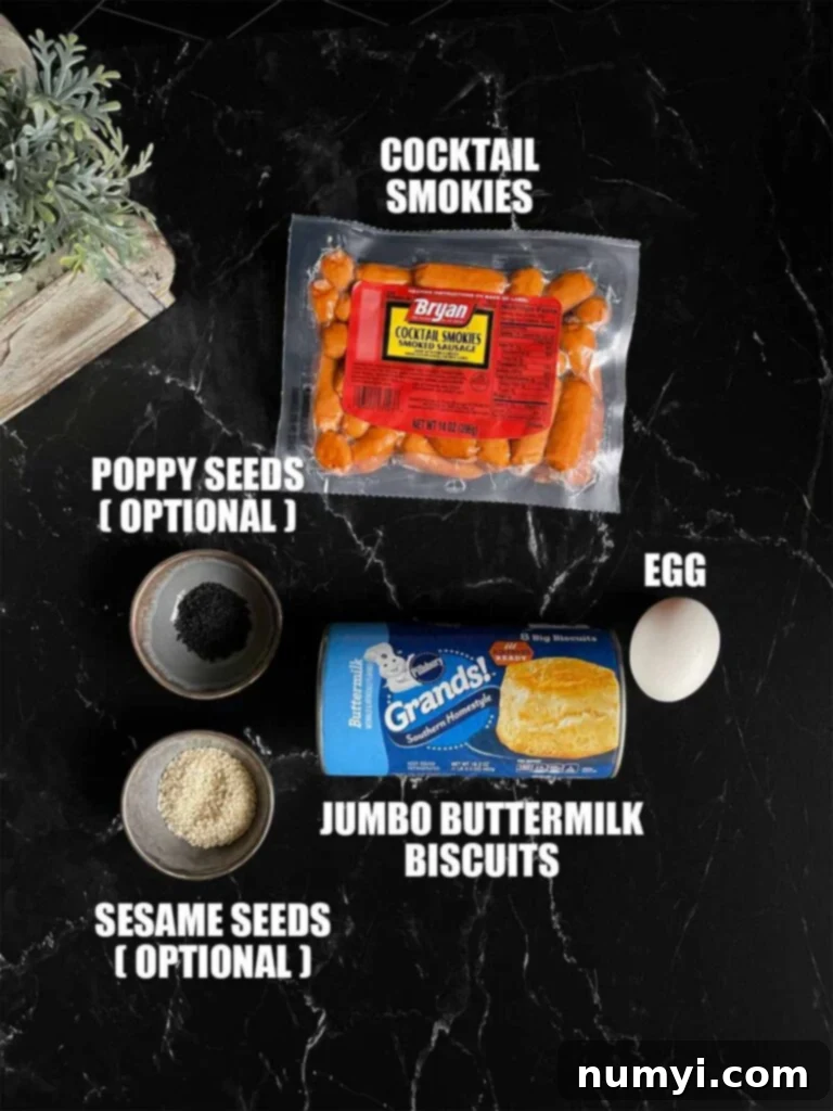 Fluffy Biscuit Pigs 3 Ingredients for pigs in a blanket on a dark surface.