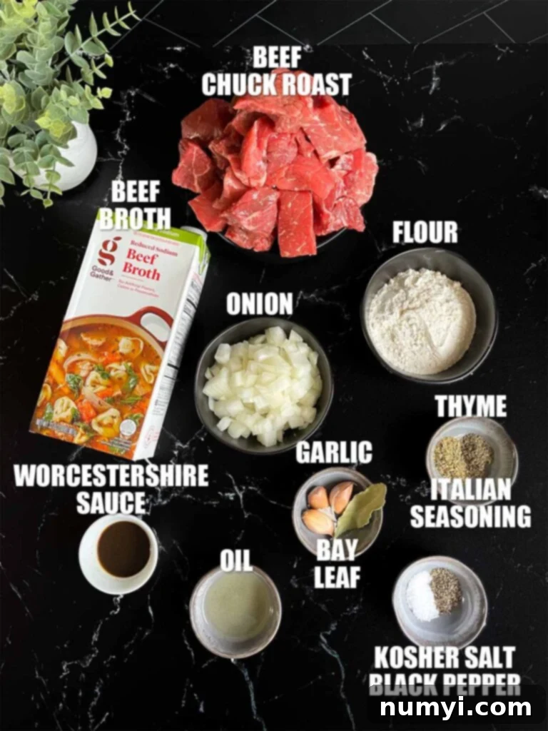 Slow cooker beef tips and gravy recipe ingredients on a dark surface.