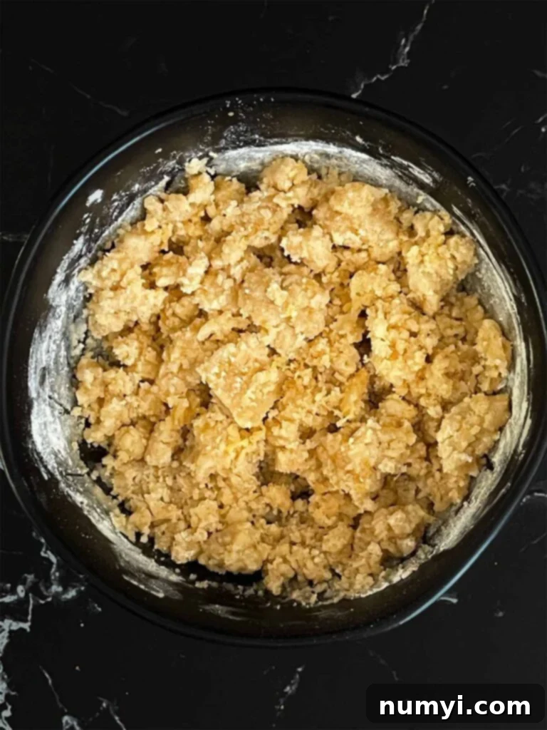 Sunshine Lemon Streusel 5 Lemon crumb cake crumble ingredients mixed in a dark bowl.