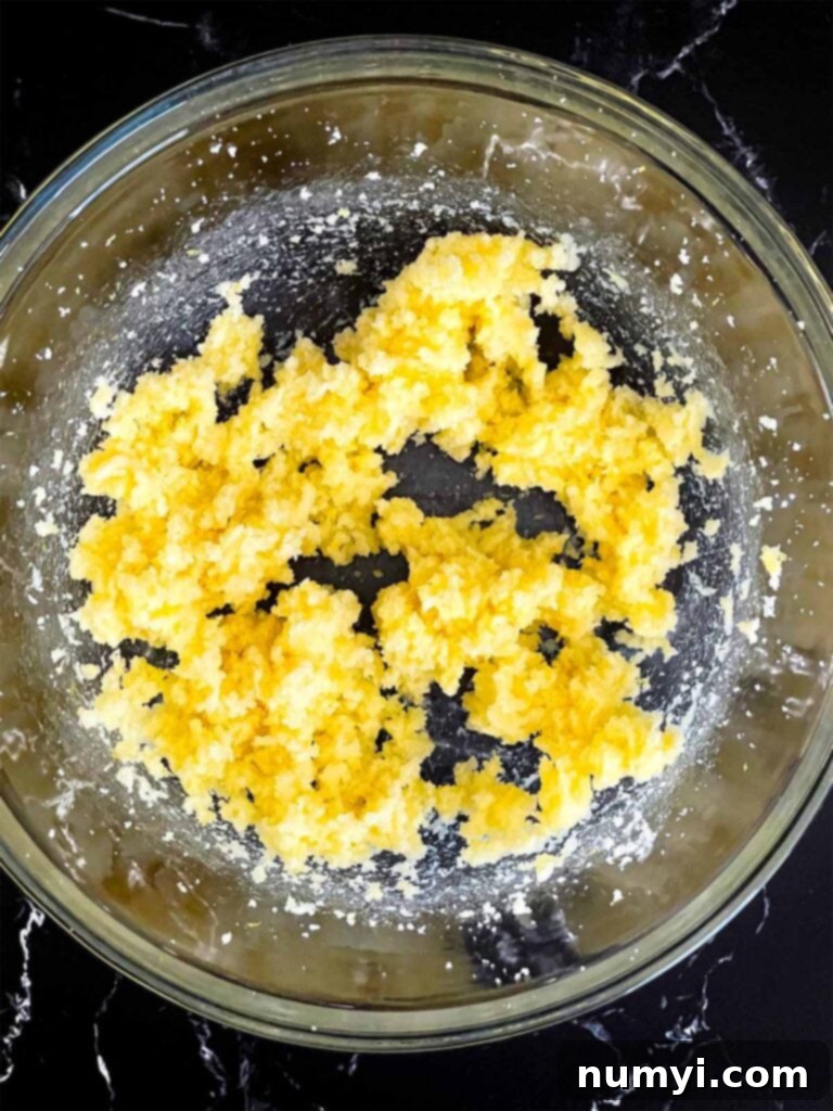 Sunshine Lemon Streusel 7 Lemon zest sugar and butter creamed together in a glass mixing bowl.