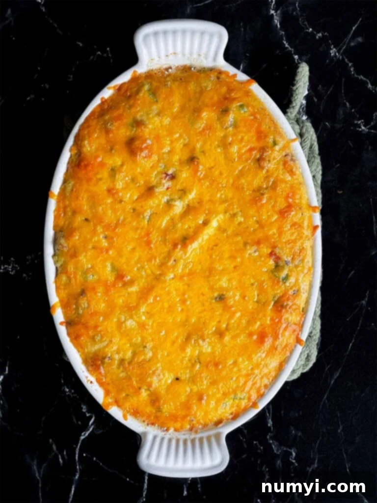 Cheesy Sausage Grits Bake 13 Baked sausage and cheese grits in a casserole dish.
