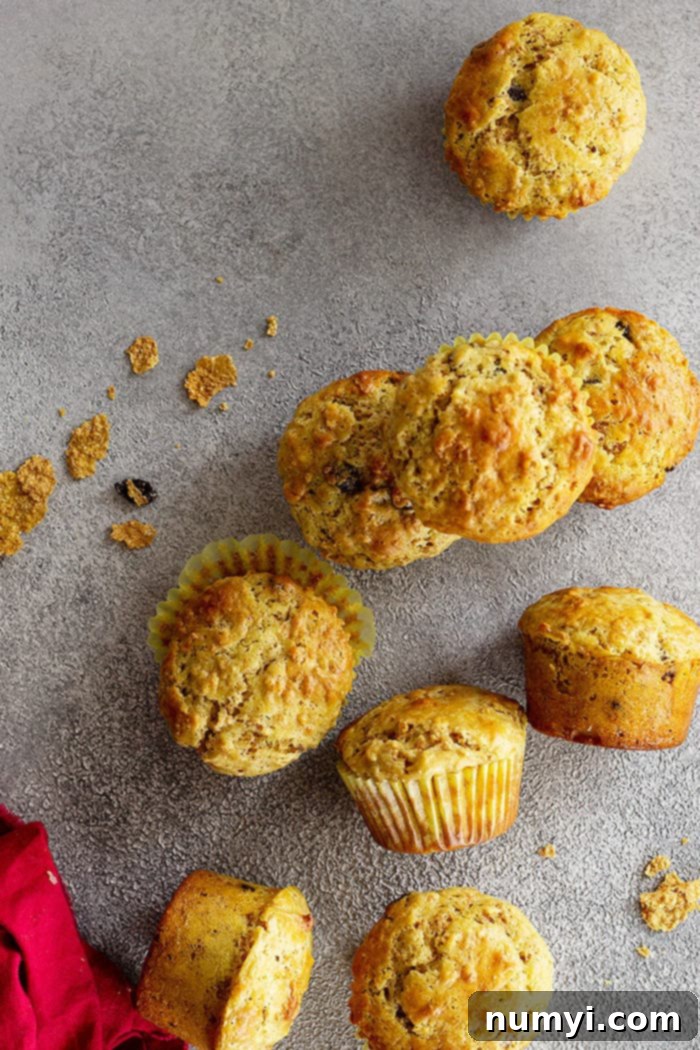 An overhead view of warm Raisin Bran Muffins, artfully arranged to highlight their golden tops and rustic appeal.