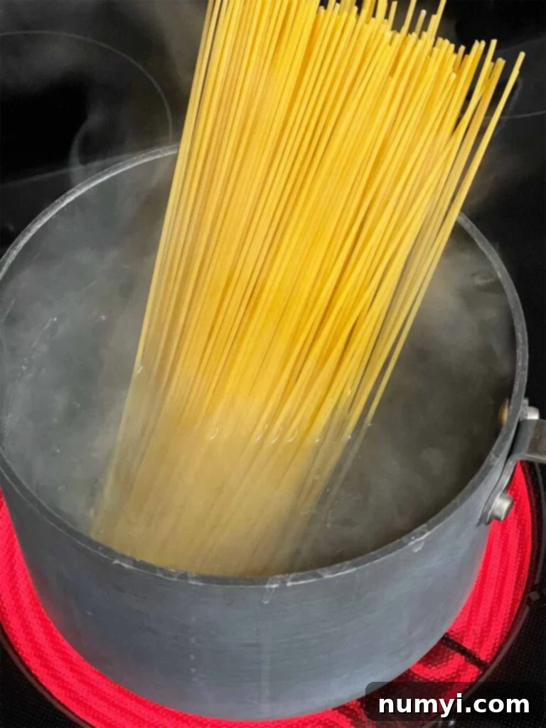 Spaghetti just added to boiling water for Tetrazzini.