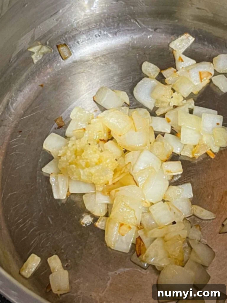 Onions and garlic cooking in a pot for the sauce base.