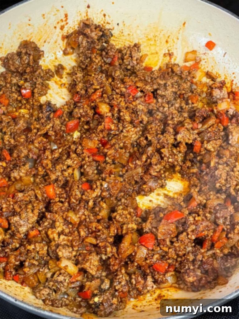 Ground beef mixture in a skillet.