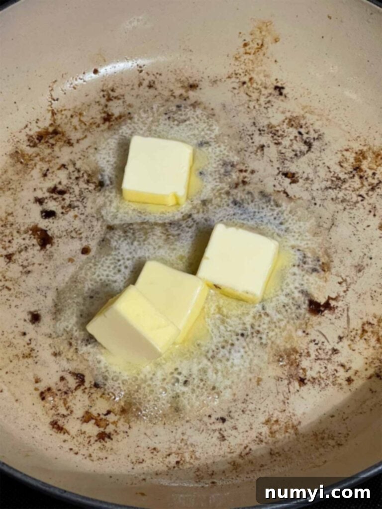 Butter melting in a skillet.