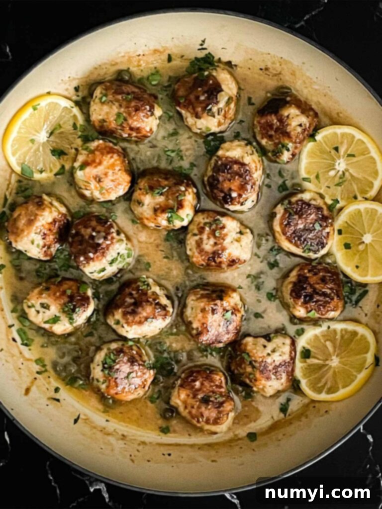 Chicken Piccata Meatballs in a skillet.