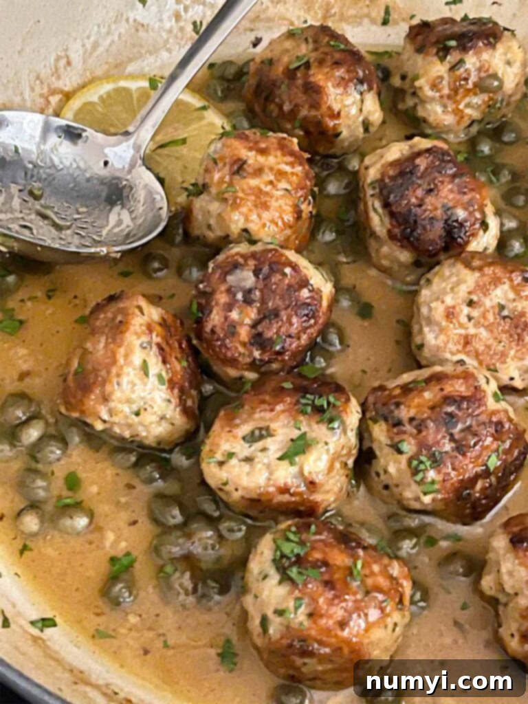Chicken Piccata Meatballs in a skillet.